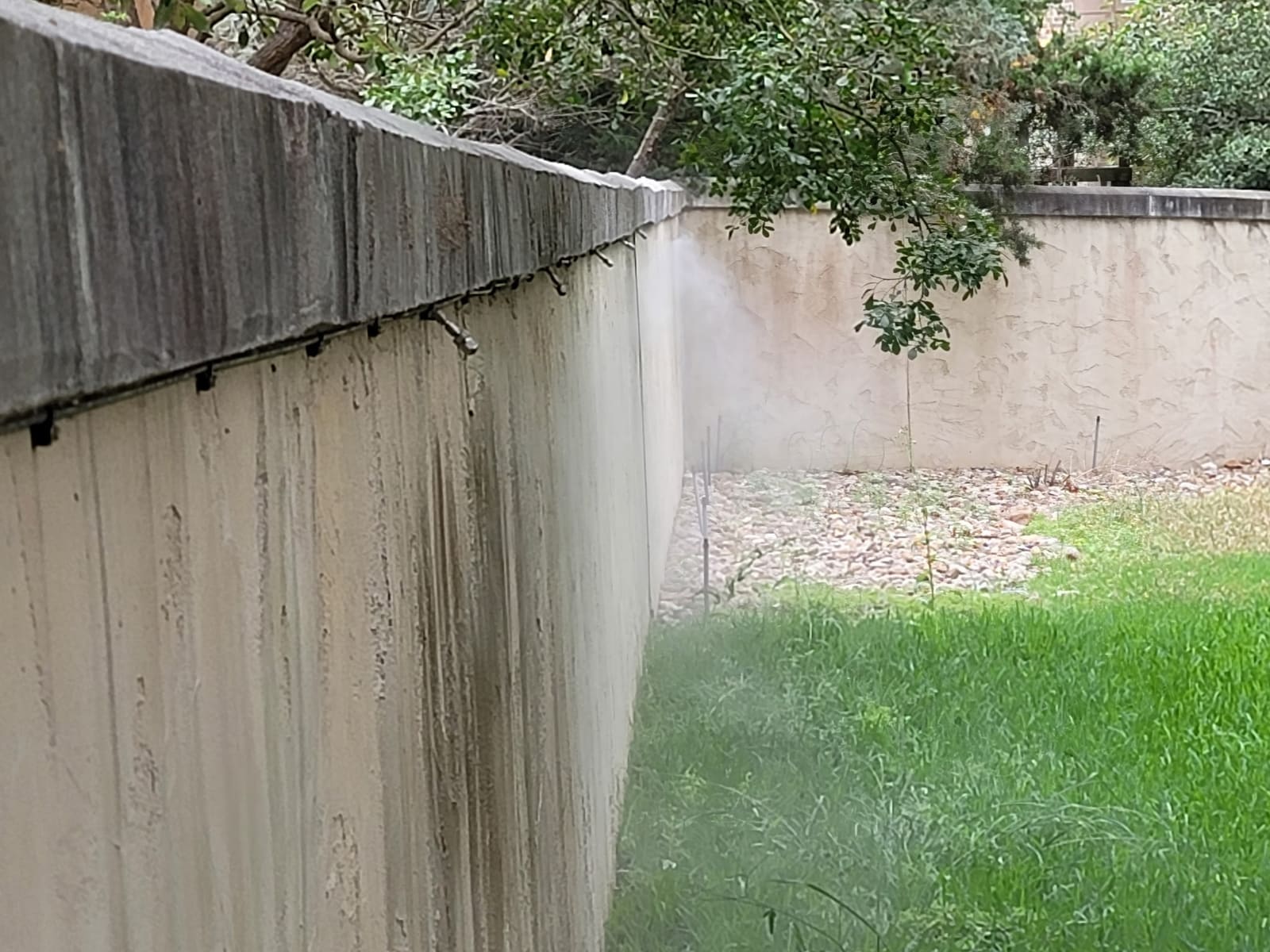 Misting system tubing and nozzles along a structure